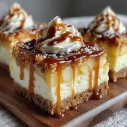 - 1 ½ cups graham cracker crumbs - ½ cup unsalted butter, melted - 1/4 cup granulated sugar - 3 medium Granny Smith apples, peeled and diced - 1 teaspoon lemon juice - 1 teaspoon cinnamon - 16 oz cream cheese, softened - 1 cup powdered sugar - 2 large eggs - 1 teaspoon vanilla extract - 1 cup caramel sauce, for drizzling
